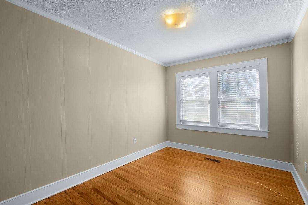611 Briarwood Circle Northwest Rome, GA 30165 - Photo 19 of 25 an empty room with wooden floor and windows