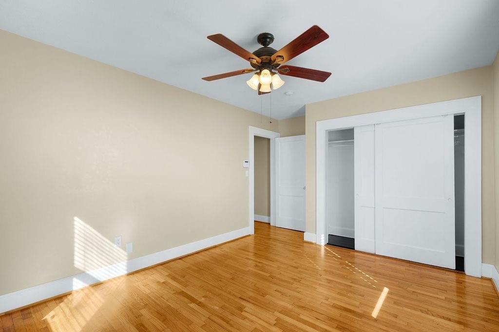 611 Briarwood Circle Northwest Rome, GA 30165 - Photo 21 of 25 a view of an empty room with wooden floor and ceiling fan