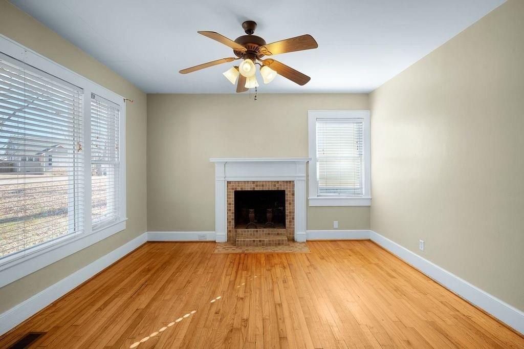 611 Briarwood Circle Northwest Rome, GA 30165 - Photo 7 of 25 a view of an empty room with wooden floor and a window