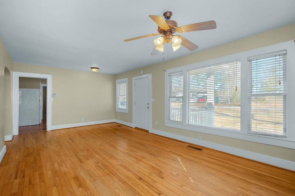 611 Briarwood Circle Northwest Rome, GA 30165 - Photo 9 of 25 a view of an empty room with a window and wooden floor