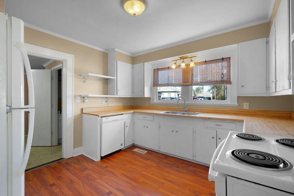 611 Briarwood Circle Northwest Rome, GA 30165 - Photo 10 of 25 a kitchen with a sink appliances cabinets and a window