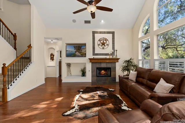 a living room with furniture and a fireplace