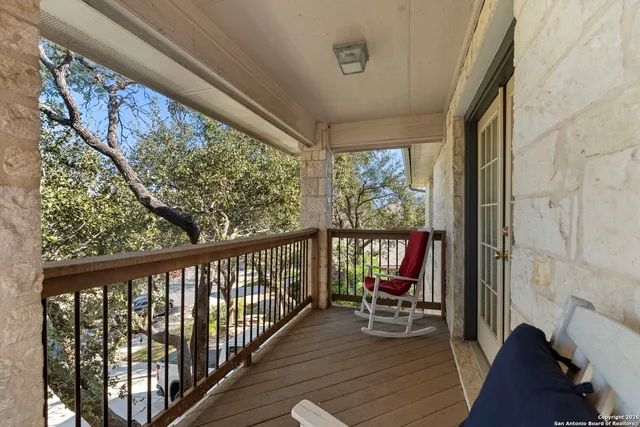 a view of a two chairs in the balcony