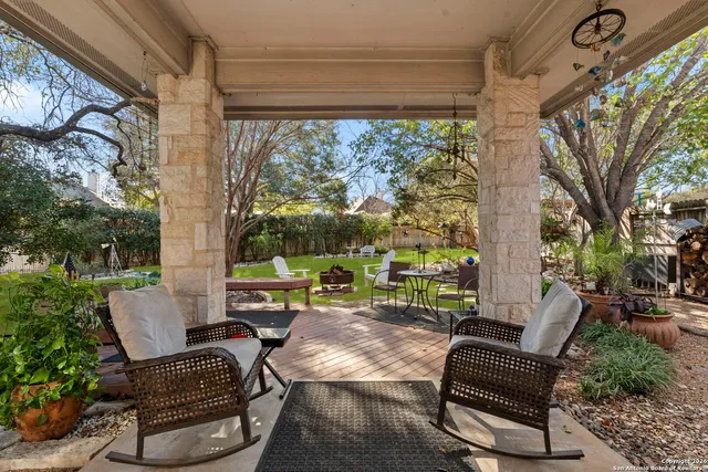 a view of patio with couple of chairs and a couch