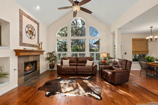 a living room with furniture fireplace and window