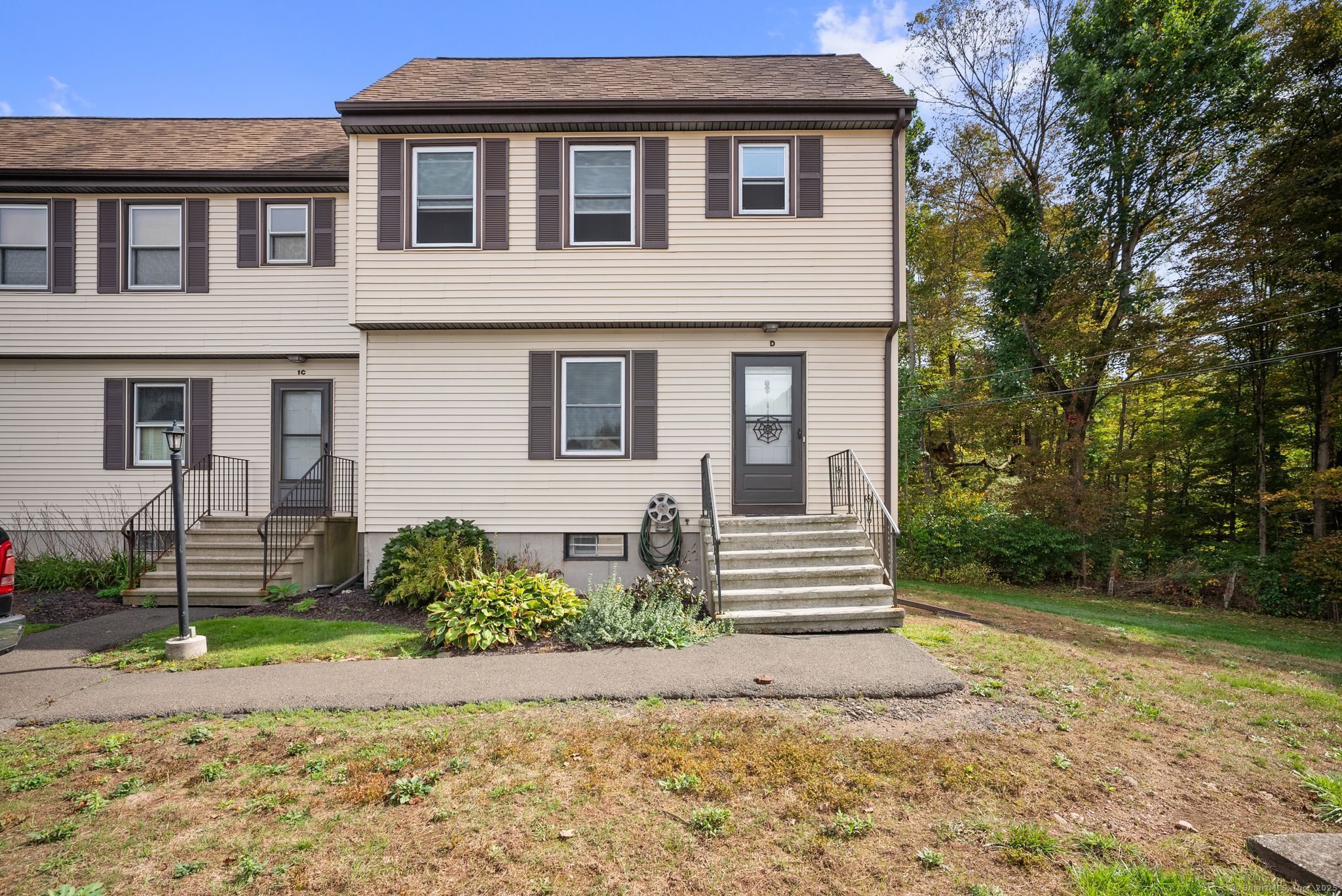 246 Reeds Gap Road, Unit 1D North Branford, CT 06472 - Photo 1 of 35 a front view of a house with garden