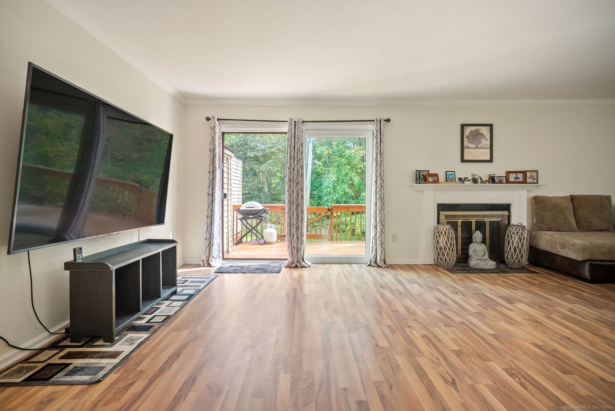 246 Reeds Gap Road, Unit 1D North Branford, CT 06472 - Photo 15 of 35 a view of livingroom with furniture flat screen tv and staircase