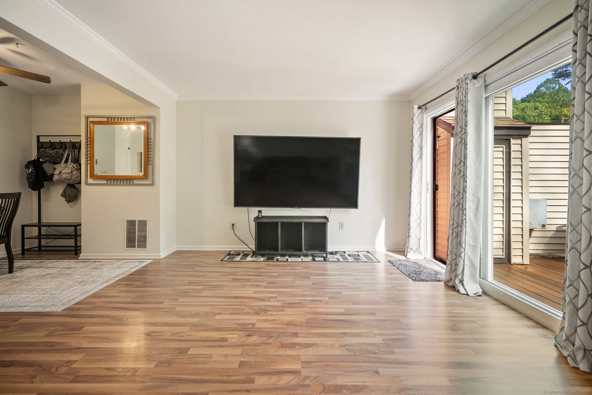 246 Reeds Gap Road, Unit 1D North Branford, CT 06472 - Photo 16 of 35 a bedroom with a bed and a flat screen tv