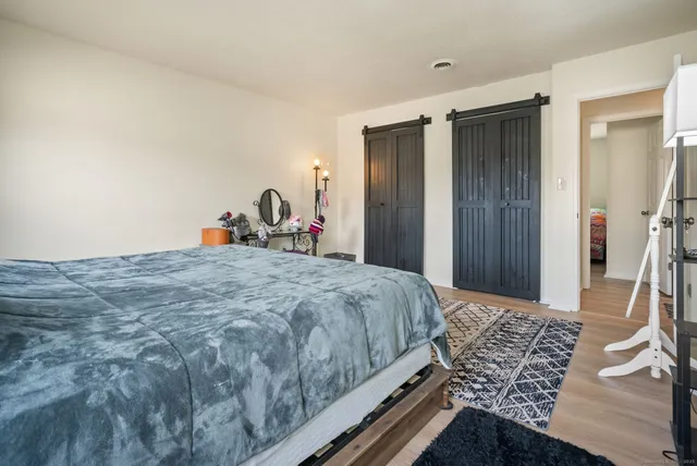 a bathroom with a granite countertop sink toilet and a shower