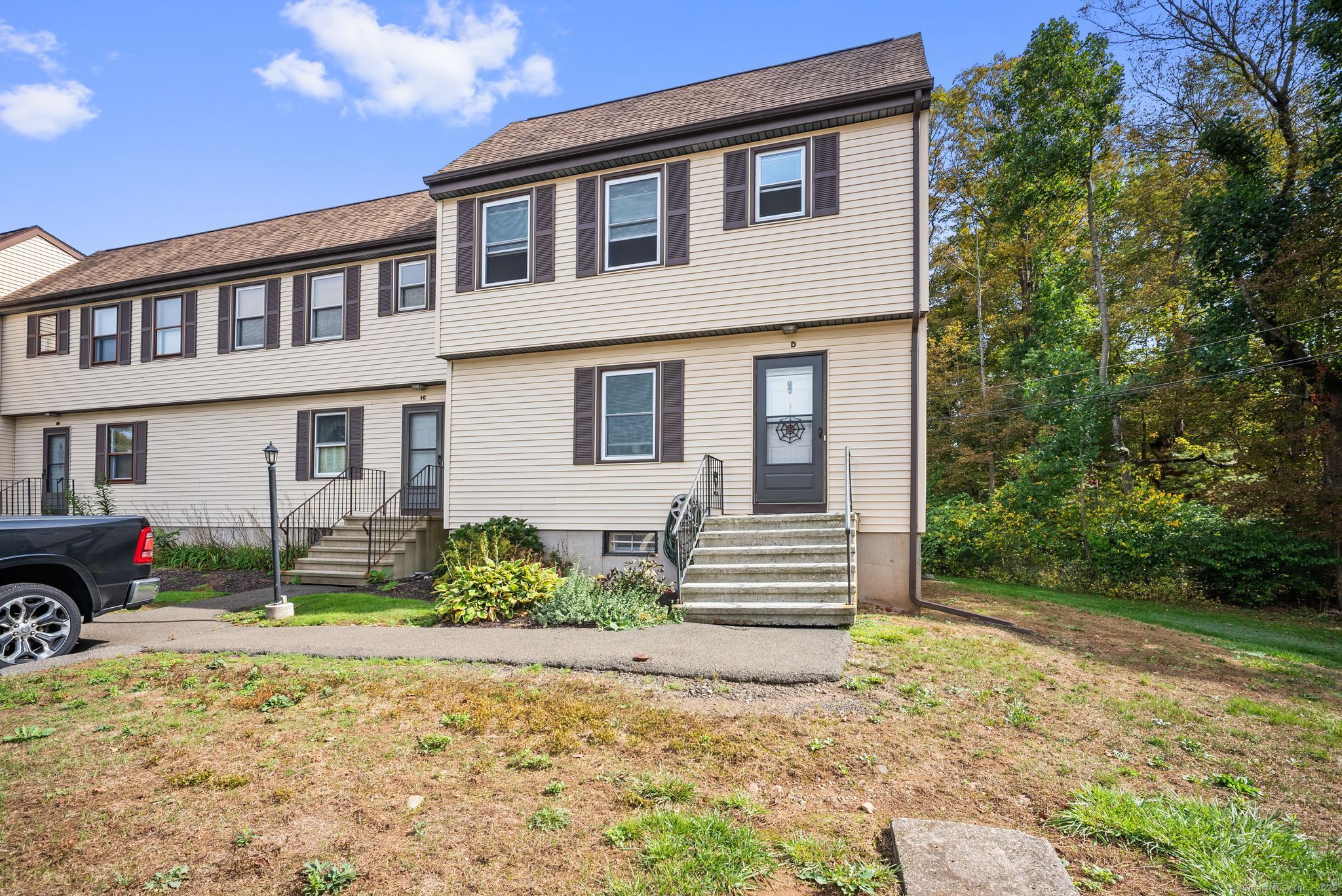 246 Reeds Gap Road, Unit 1D North Branford, CT 06472 - Photo 2 of 35 a front view of a house with garden