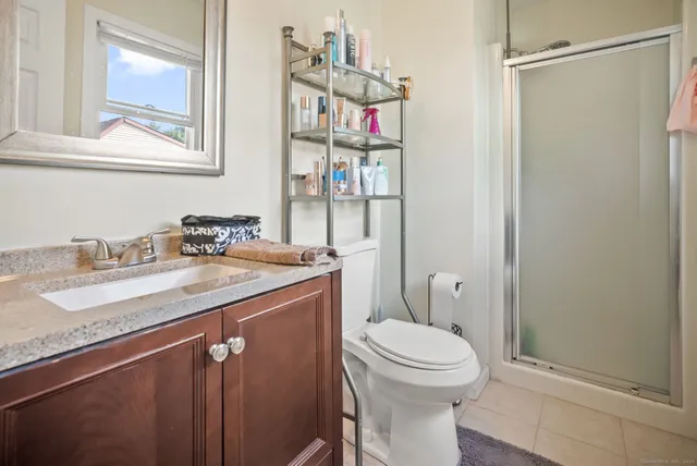 a bedroom with a bed and walk in closet