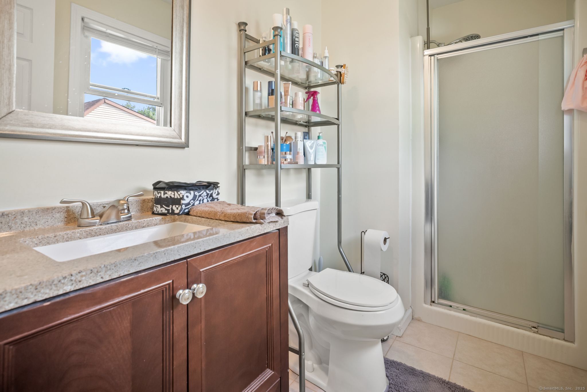 246 Reeds Gap Road, Unit 1D North Branford, CT 06472 - Photo 21 of 35 a bathroom with a granite countertop sink toilet and a shower