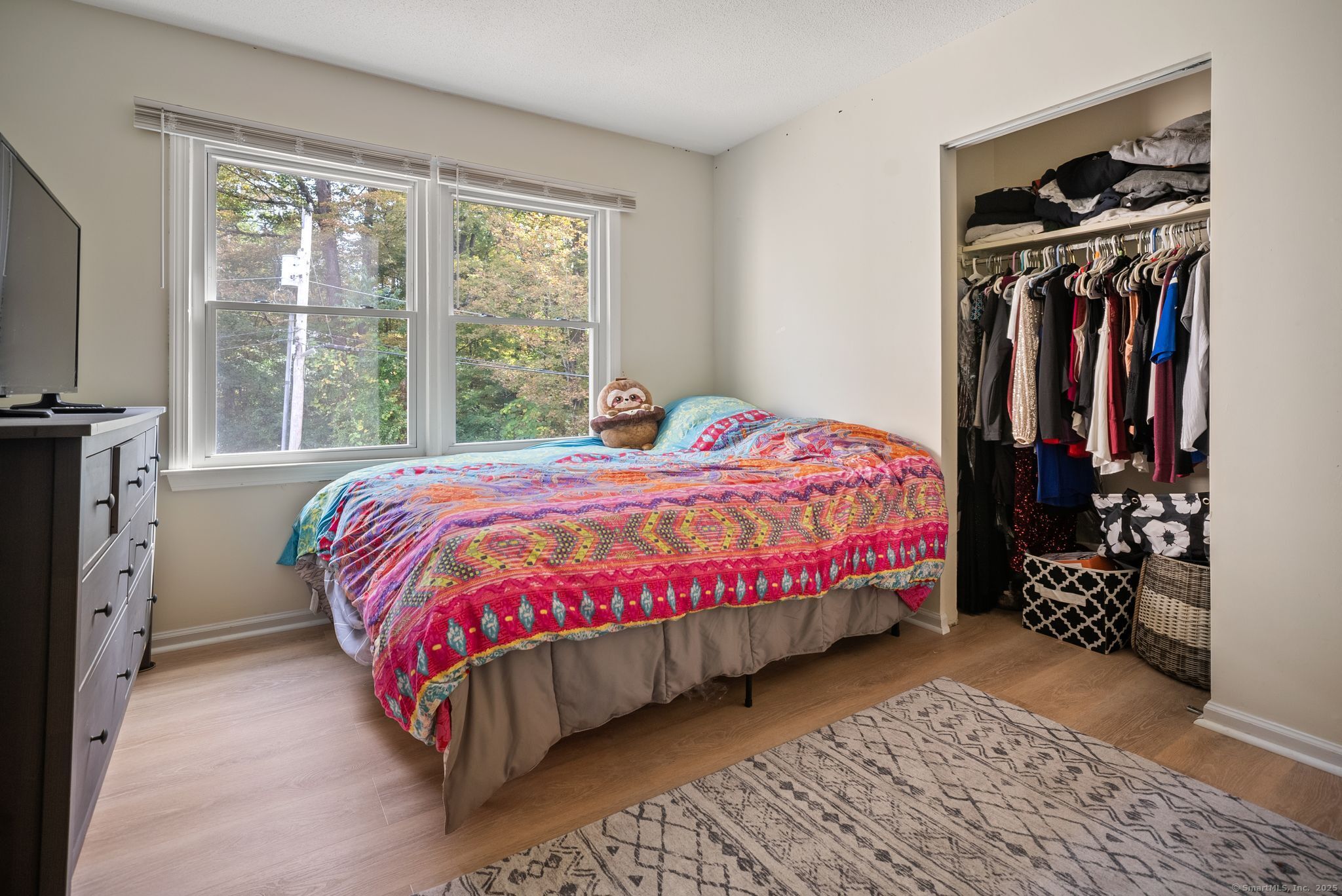 246 Reeds Gap Road, Unit 1D North Branford, CT 06472 - Photo 23 of 35 a bedroom with a bed and a window