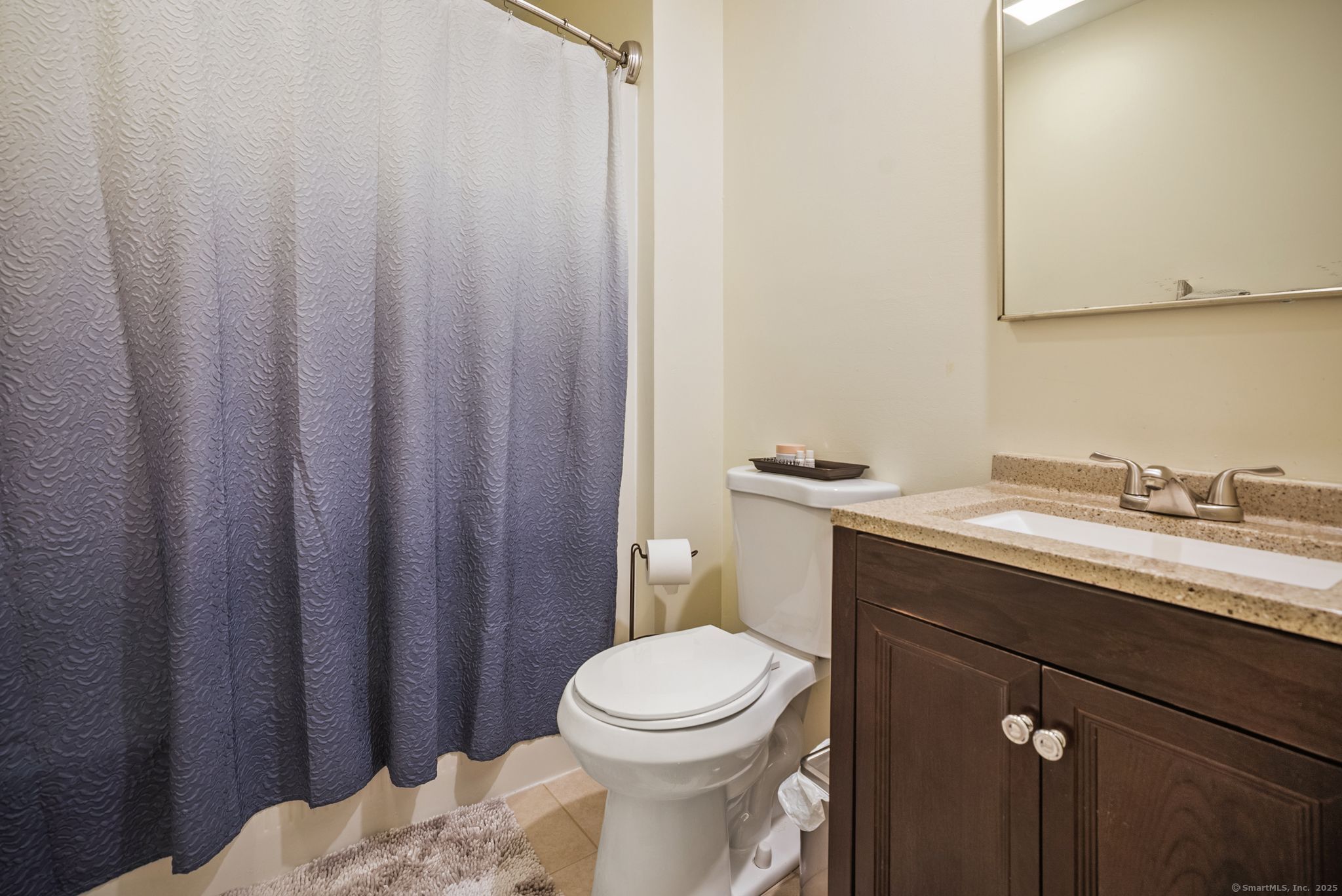 246 Reeds Gap Road, Unit 1D North Branford, CT 06472 - Photo 26 of 35 a bathroom with a granite countertop sink toilet and a mirror