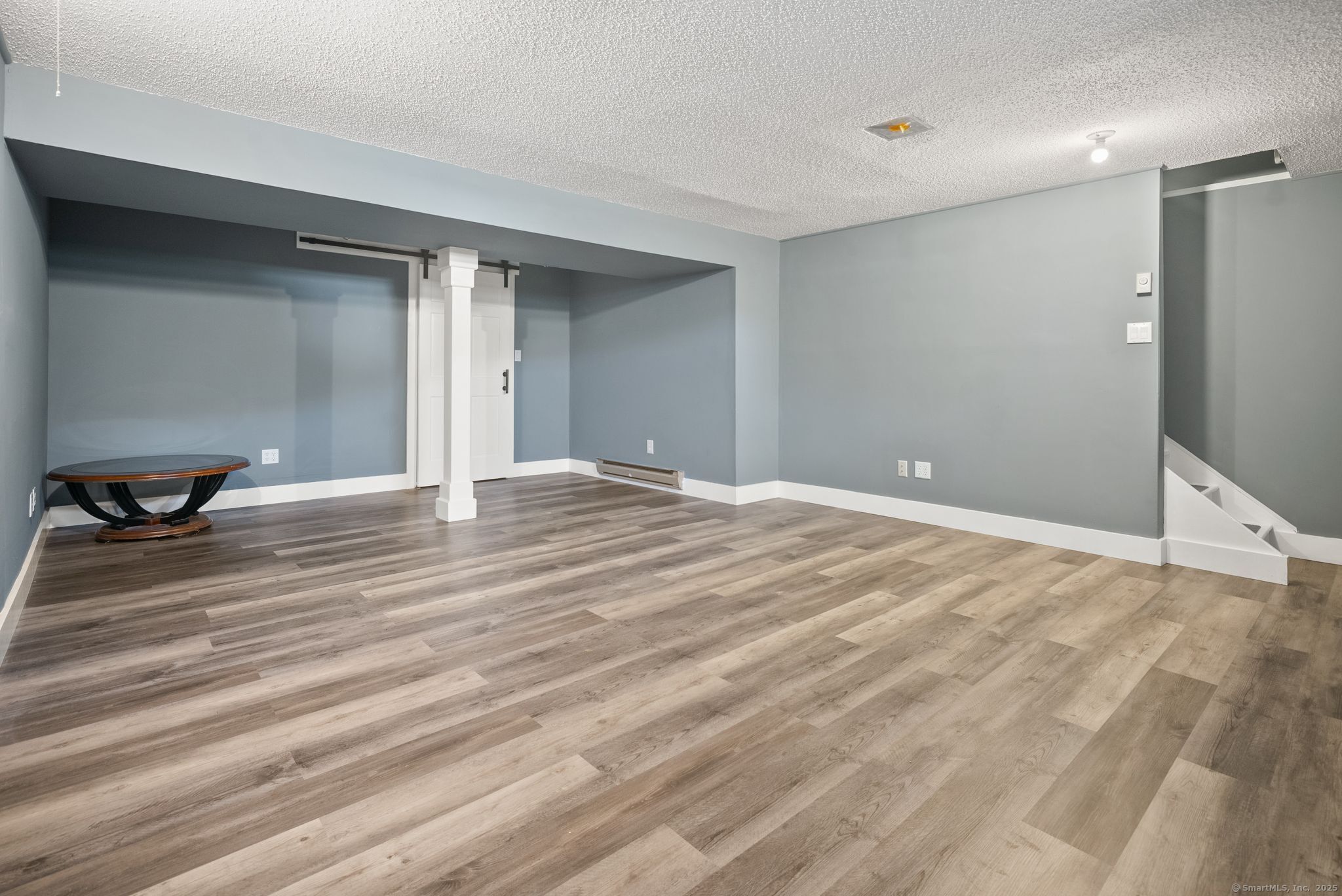 246 Reeds Gap Road, Unit 1D North Branford, CT 06472 - Photo 28 of 35 a view of a room with wooden floor