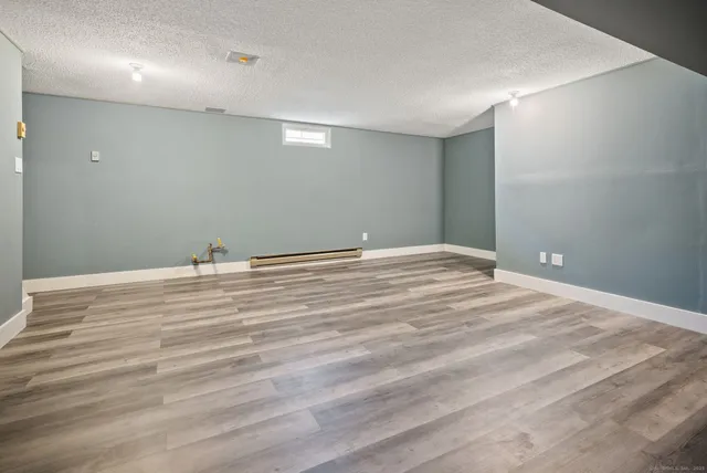 a view of balcony with wooden floor and outdoor seating
