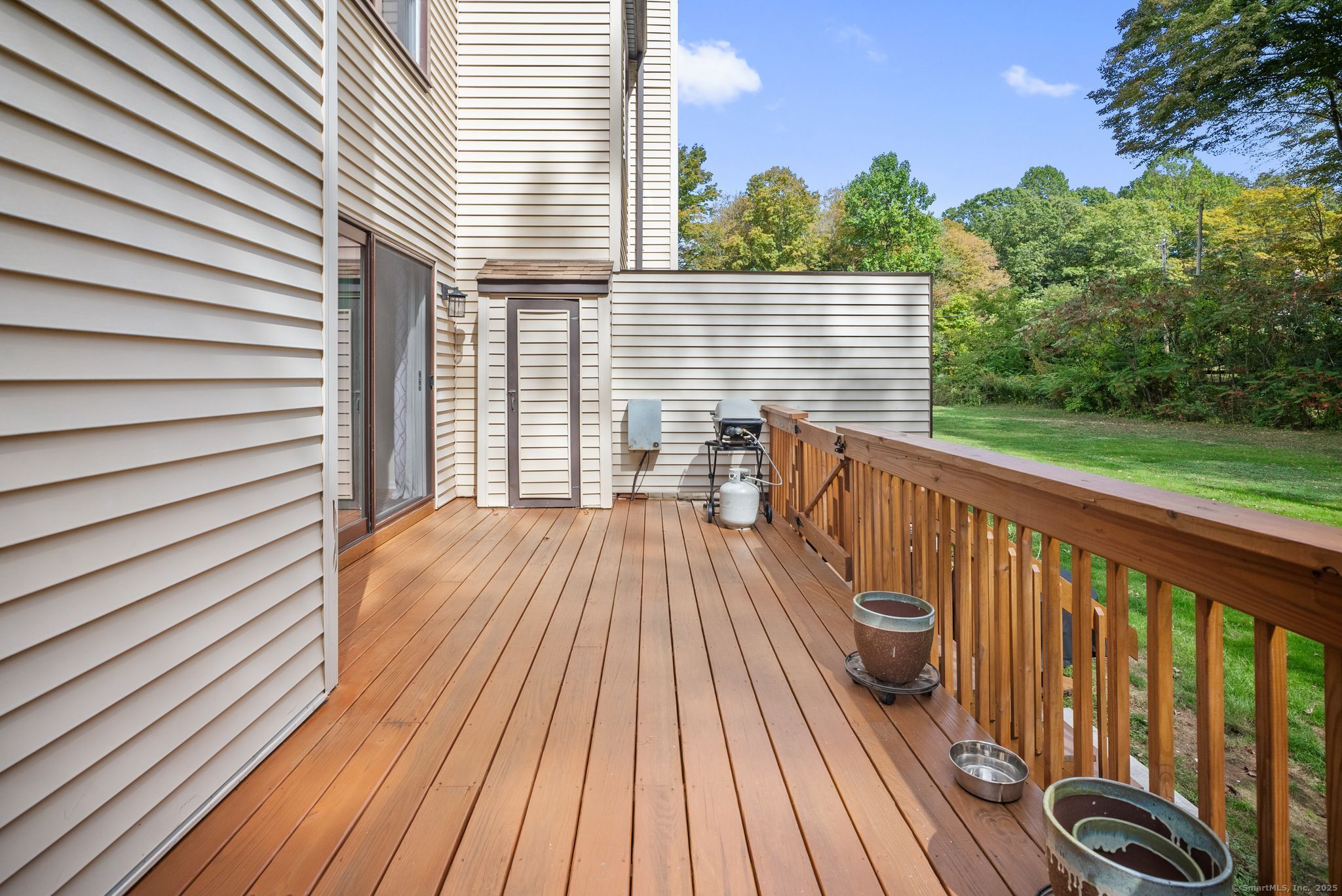 246 Reeds Gap Road, Unit 1D North Branford, CT 06472 - Photo 31 of 35 a view of a roof deck with wooden floor and fence