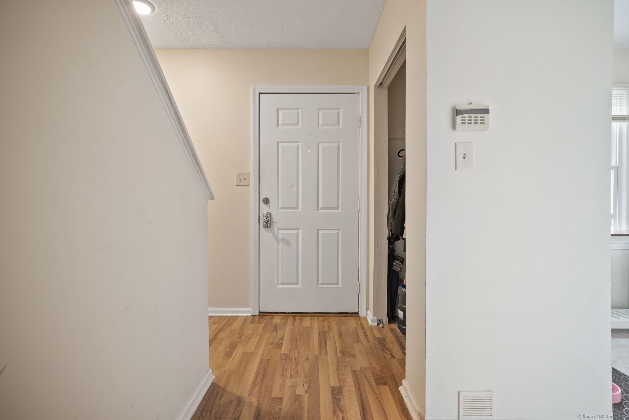 246 Reeds Gap Road, Unit 1D North Branford, CT 06472 - Photo 4 of 35 a view of a hallway with wooden floor and entryway