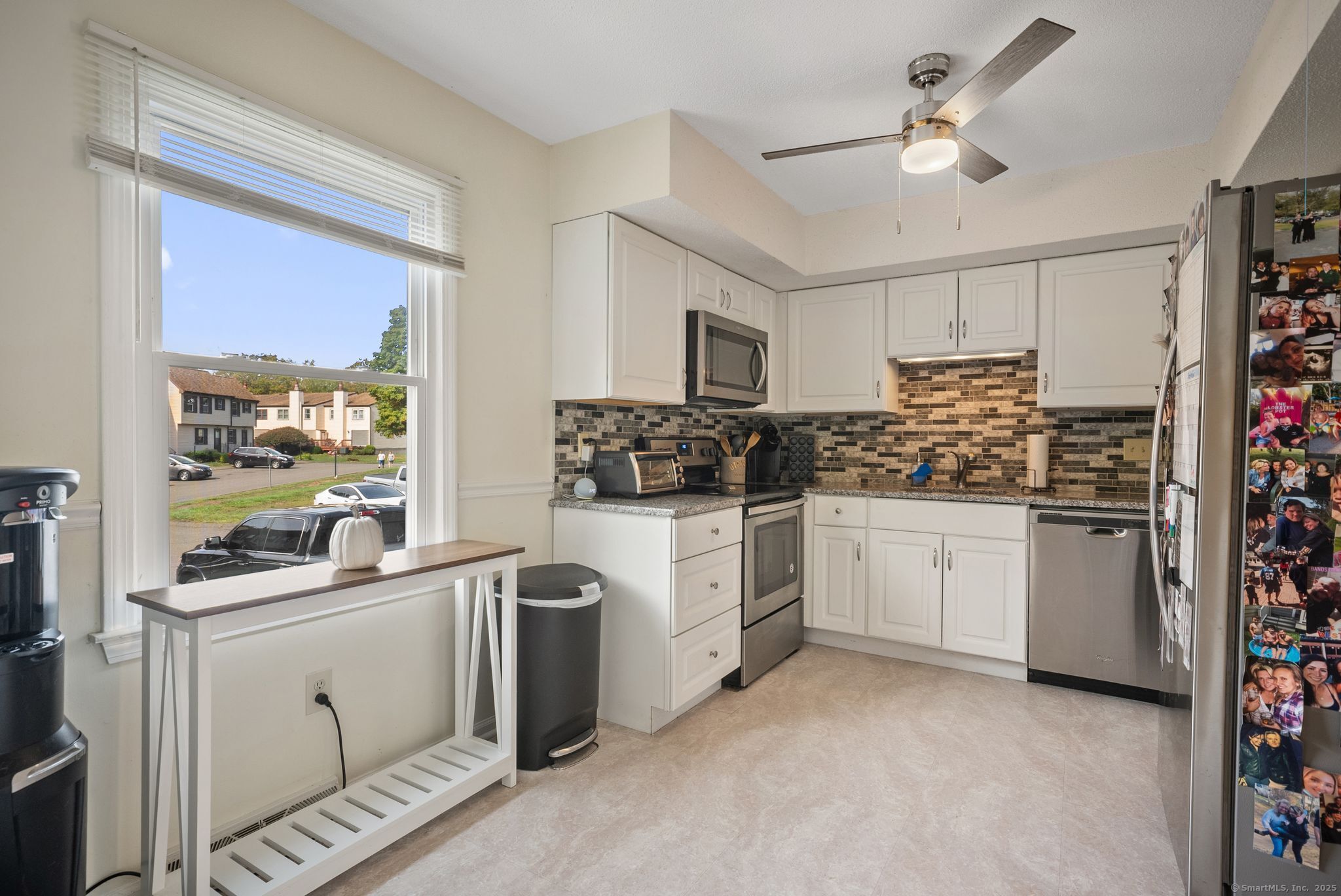 246 Reeds Gap Road, Unit 1D North Branford, CT 06472 - Photo 7 of 35 a kitchen with white cabinets and white appliances