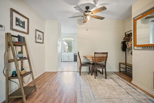 a view of a livingroom with furniture and a workspace