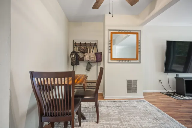 a view of a livingroom with furniture and wooden floor