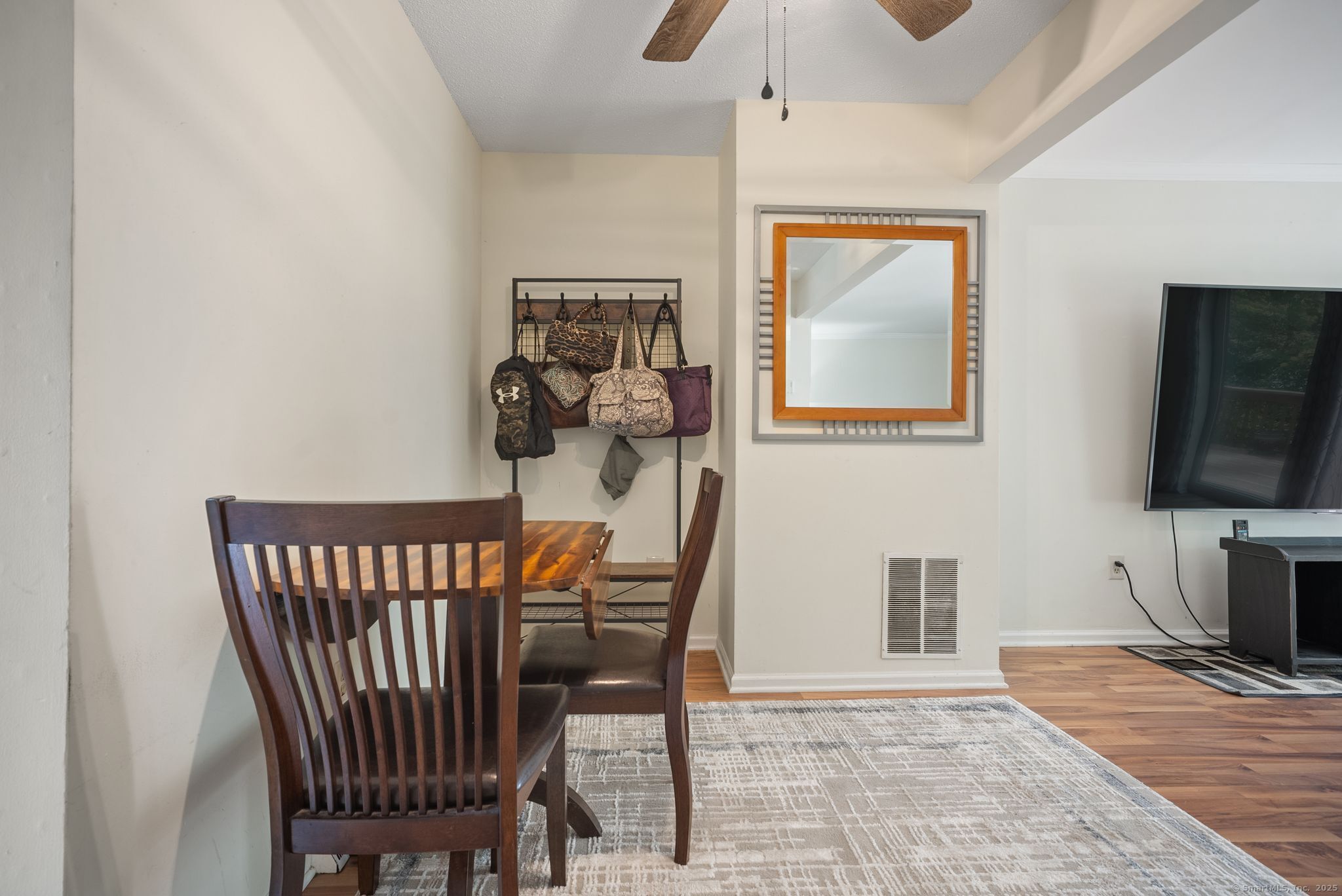 246 Reeds Gap Road, Unit 1D North Branford, CT 06472 - Photo 10 of 35 a view of a livingroom with furniture and wooden floor