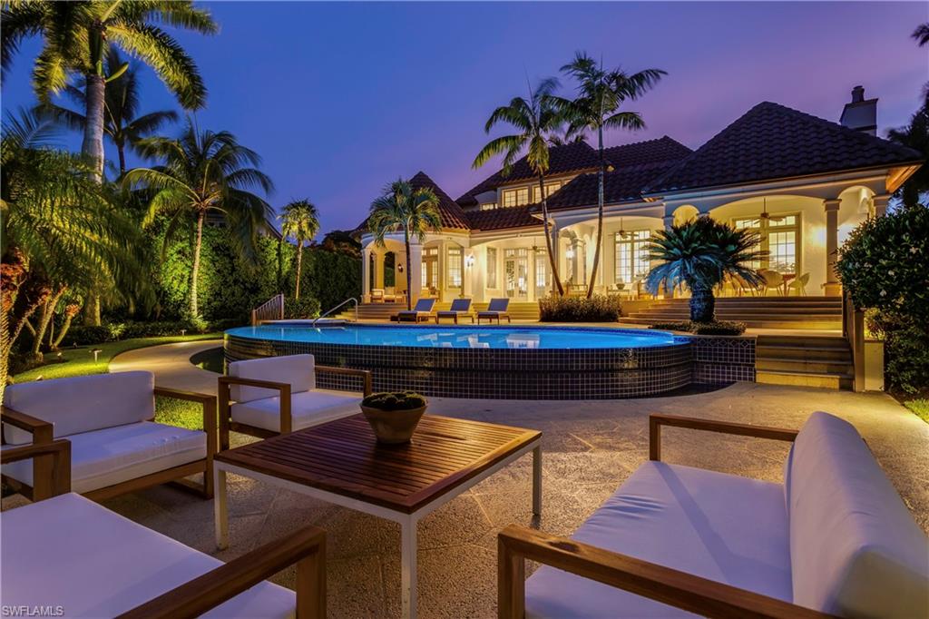 2595 Half Moon Walk Naples, FL 34102 - Photo 32 of 35 a view of a chairs and table in the patio