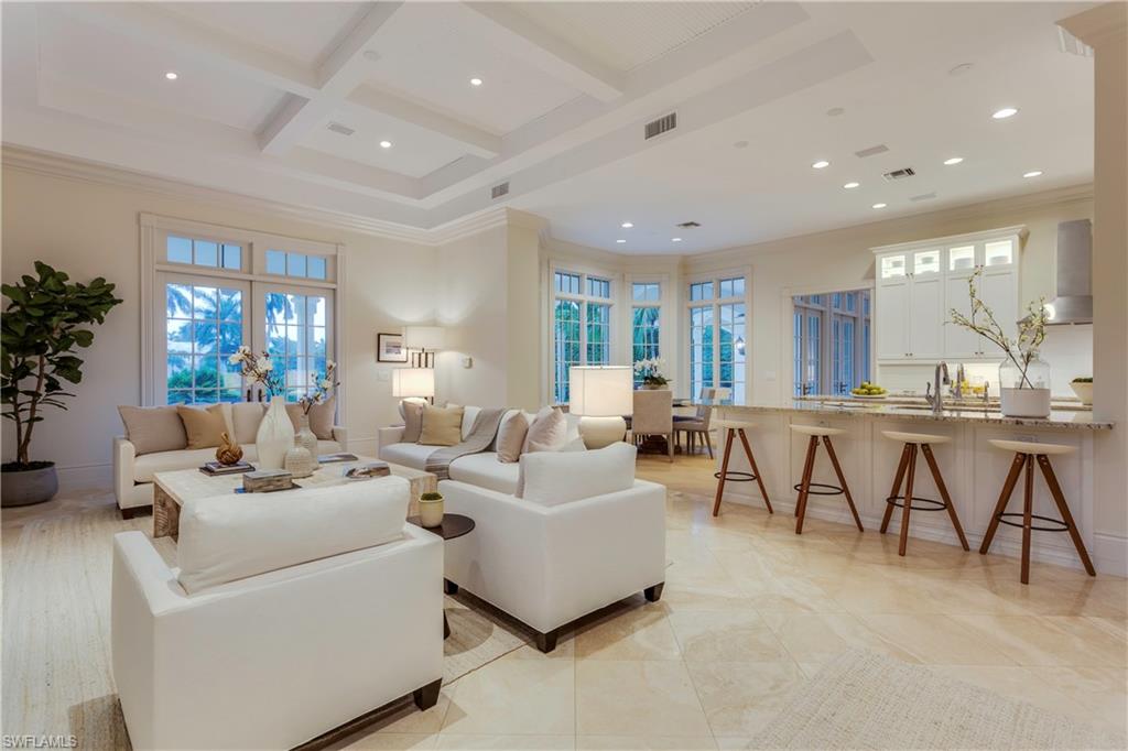 2595 Half Moon Walk Naples, FL 34102 - Photo 5 of 35 a living room with furniture and a table