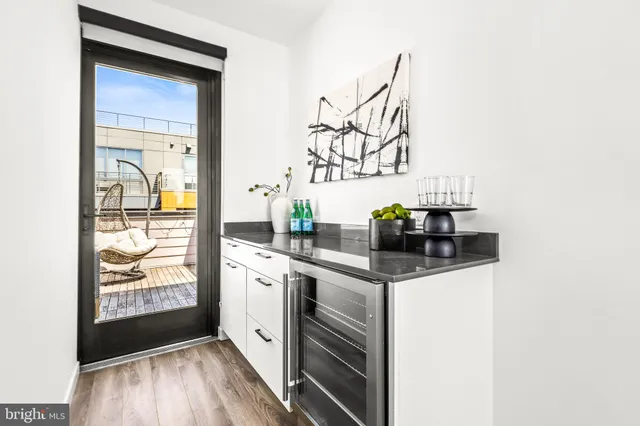 a kitchen with stainless steel appliances a sink and cabinets