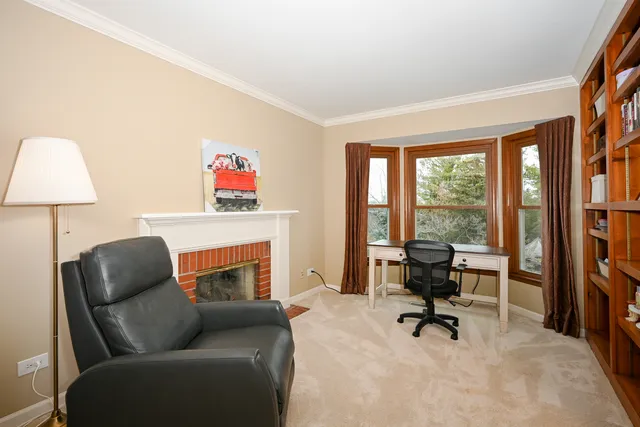 a living room with furniture fireplace and rug floor