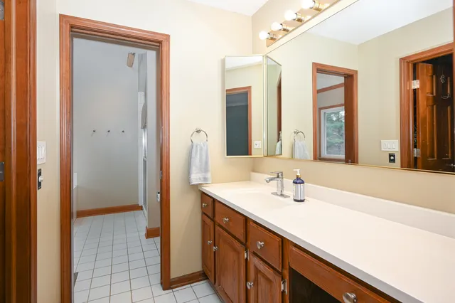 a bathroom with a sink and a mirror