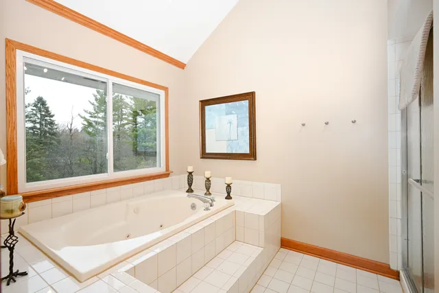 a bathroom with a tub and a sink