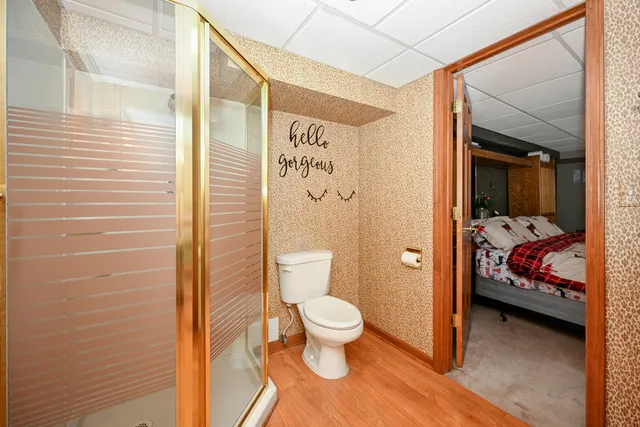 a view of a bedroom with a bed and furniture