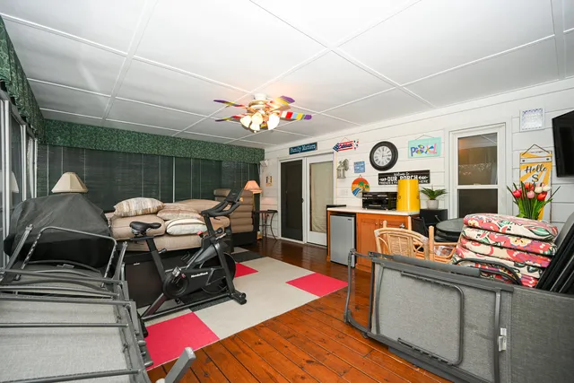 a view of a dining room with furniture and chandelier