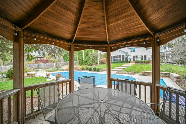 a view of a backyard with iron fence