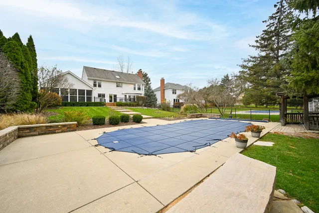 a view of a swimming pool with an outdoor space and seating area