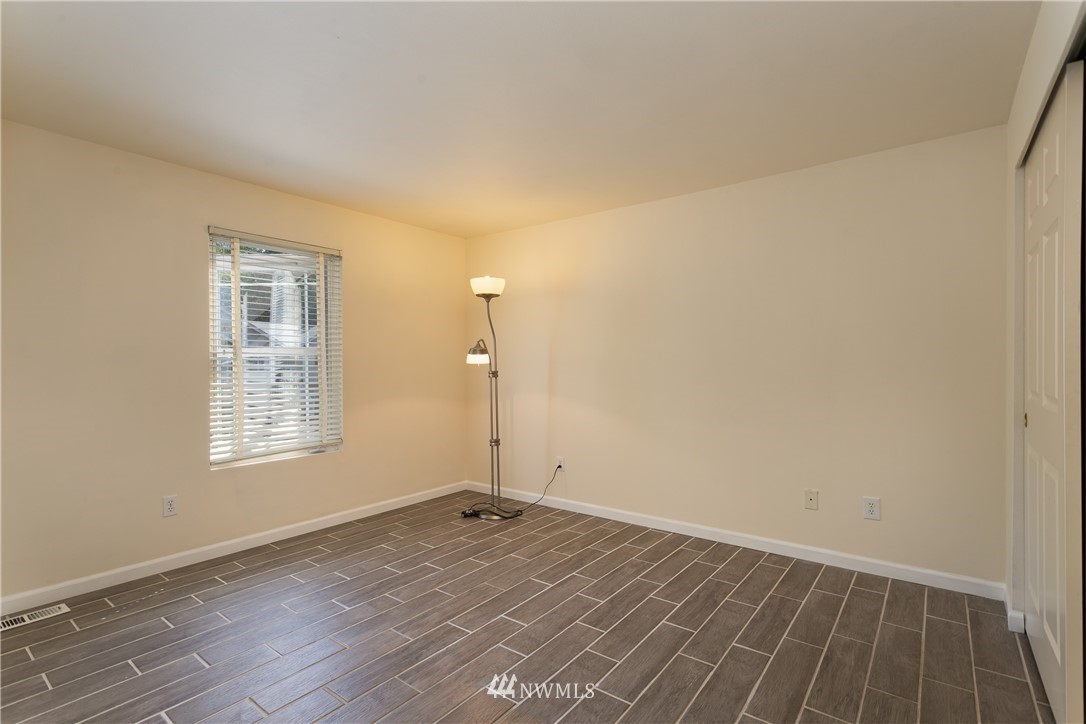 507 211th Place Southeast Bothell, WA 98021 - Photo 14 of 26 a view of a room that has wooden floor and window