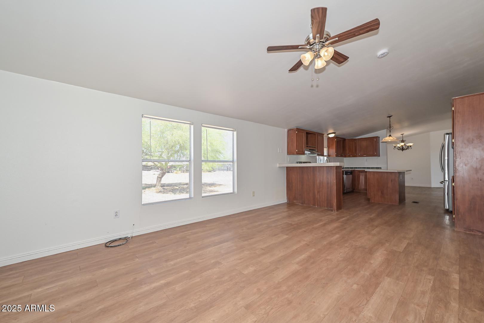 36608 West Lower Buckeye Road Tonopah, AZ 85354 - Photo 17 of 39 an empty room with windows and ceiling fan