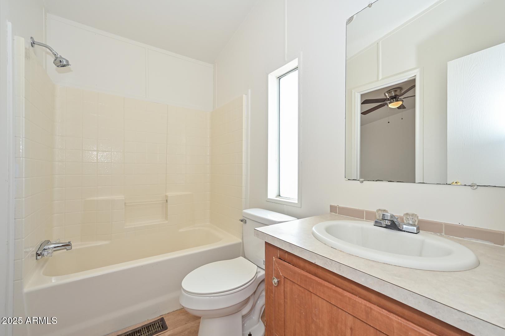 36608 West Lower Buckeye Road Tonopah, AZ 85354 - Photo 22 of 39 a bathroom with a granite countertop sink toilet and shower