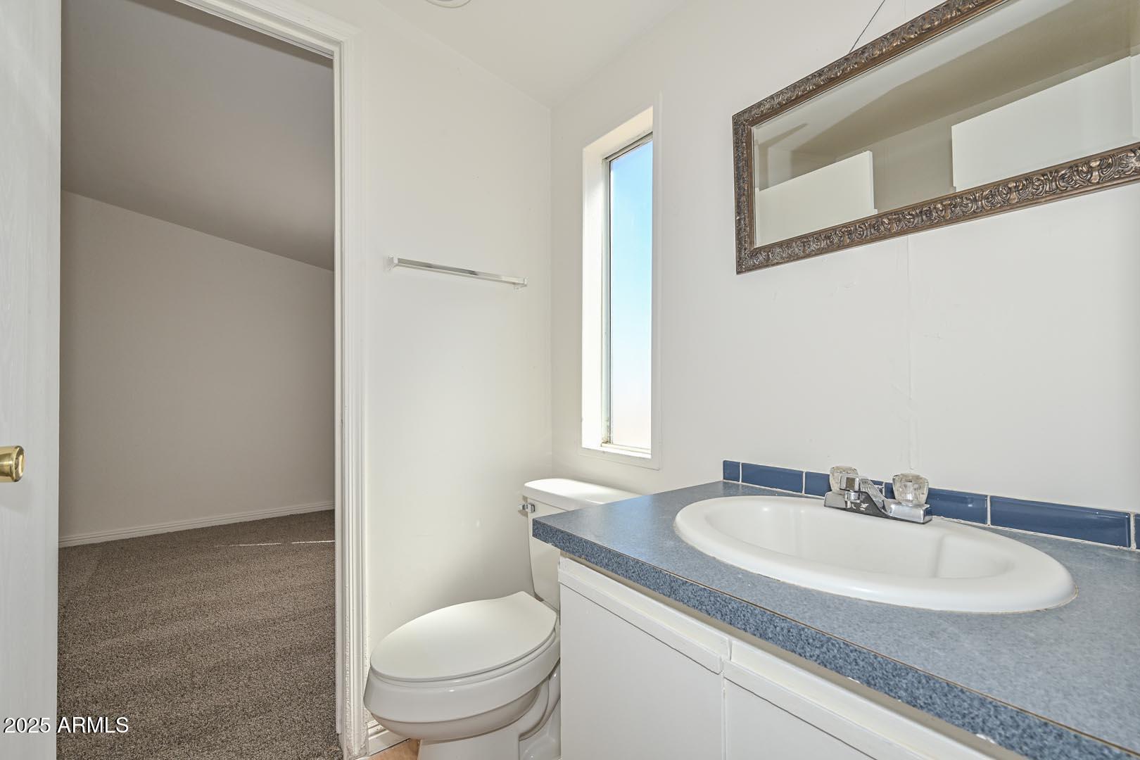 36608 West Lower Buckeye Road Tonopah, AZ 85354 - Photo 25 of 39 a bathroom with a sink and a toilet