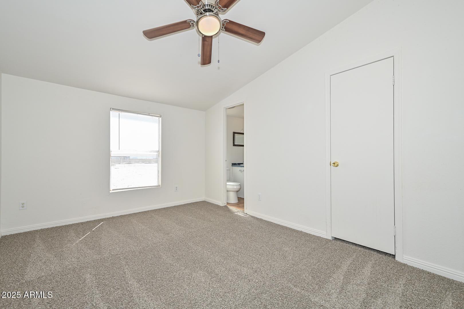 36608 West Lower Buckeye Road Tonopah, AZ 85354 - Photo 28 of 39 an empty room with windows and fan