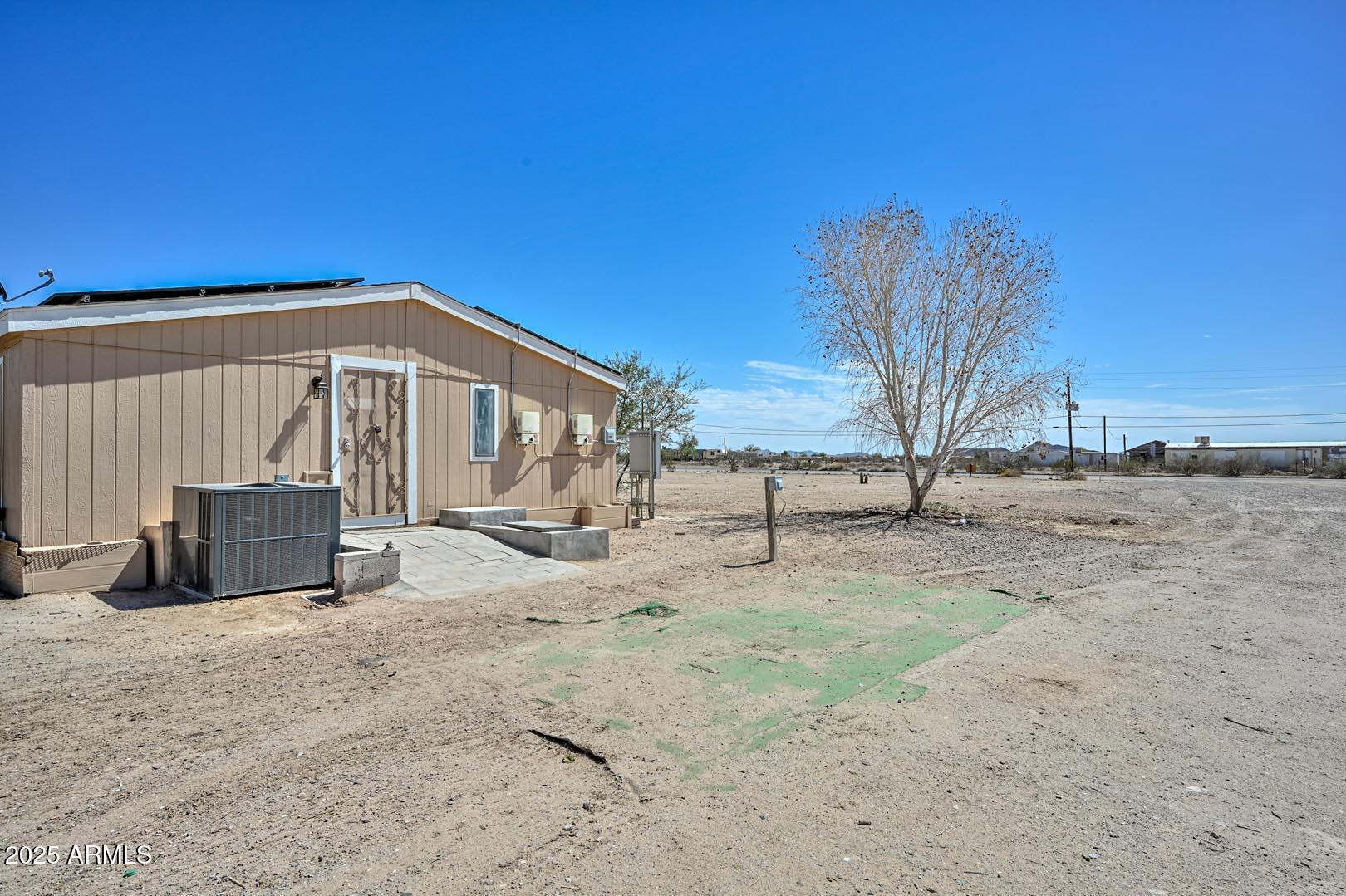 36608 West Lower Buckeye Road Tonopah, AZ 85354 - Photo 3 of 39 a view of a house with a snow in the yard