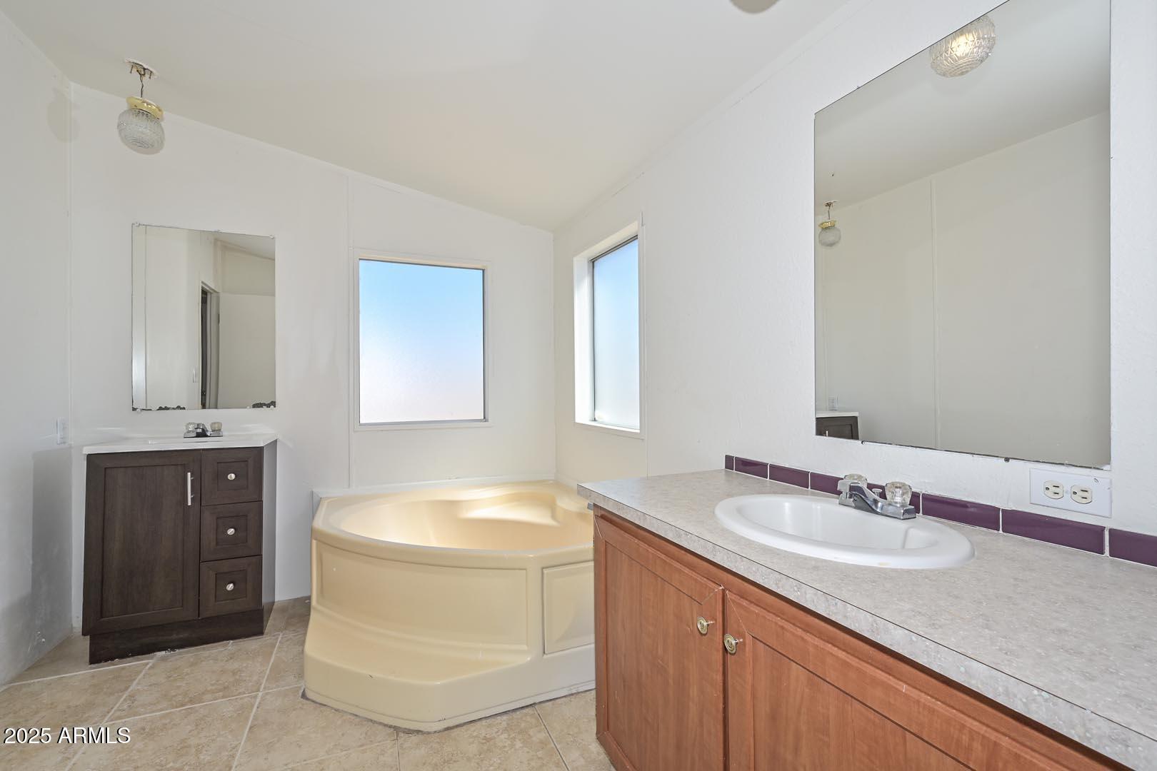 36608 West Lower Buckeye Road Tonopah, AZ 85354 - Photo 33 of 39 a bathroom with a granite countertop sink and a mirror