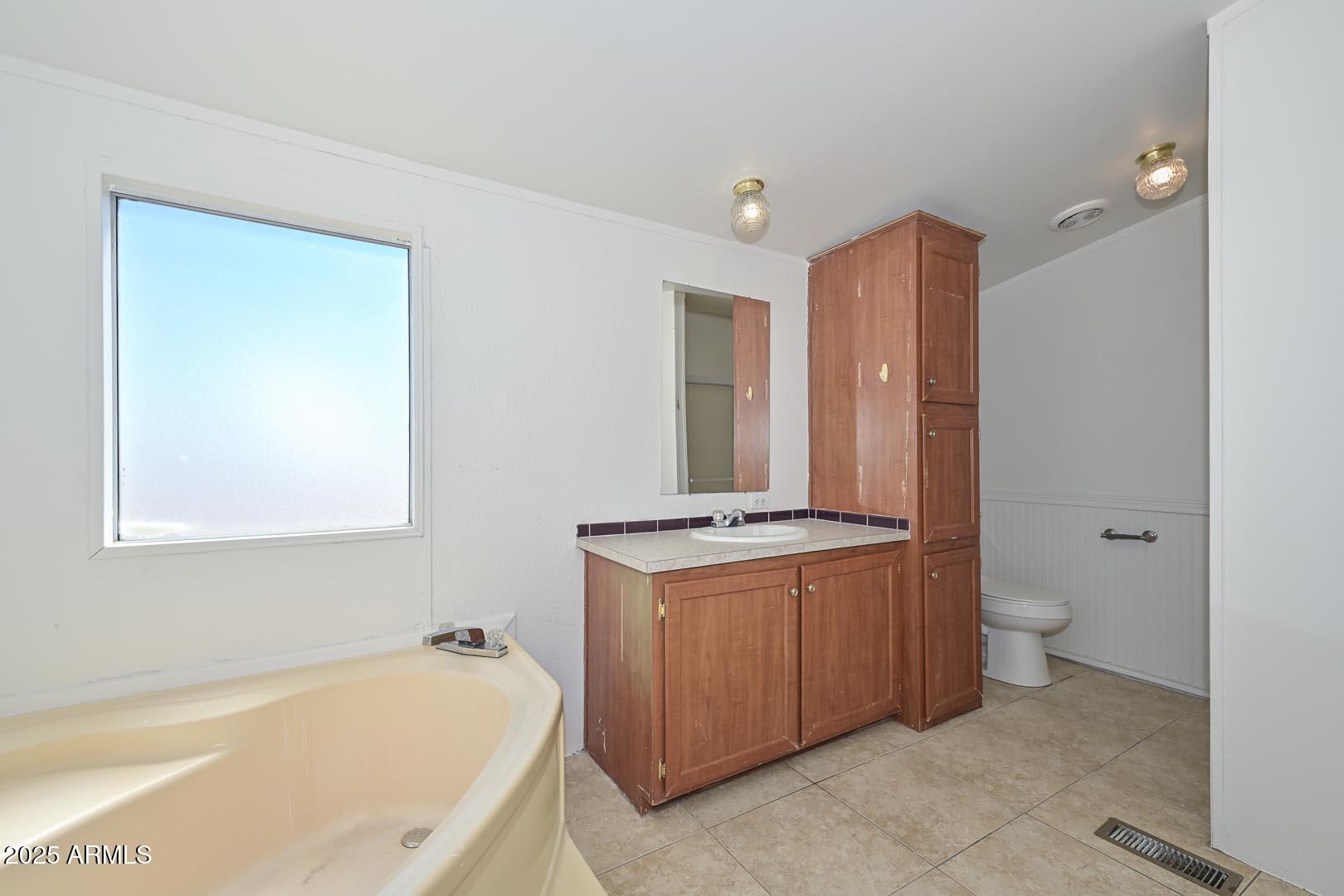 36608 West Lower Buckeye Road Tonopah, AZ 85354 - Photo 34 of 39 a bathroom with a granite countertop sink and a bathtub