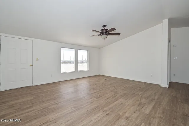 a view of a kitchen with a sink and dishwasher wooden floor