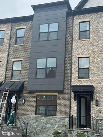 a front view of a house with glass windows