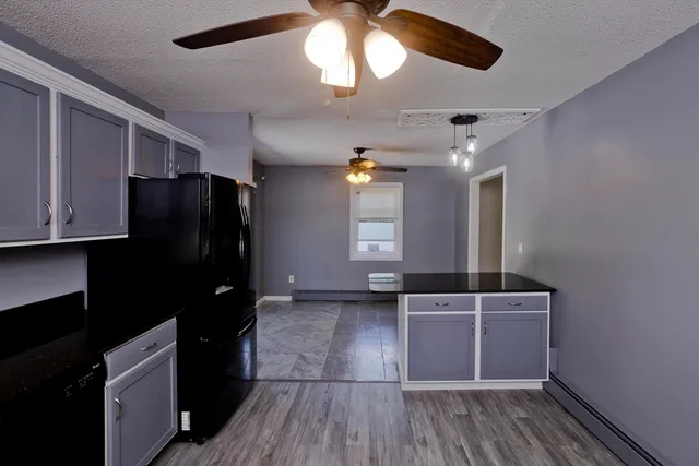 a kitchen with a sink stainless steel appliances and cabinets