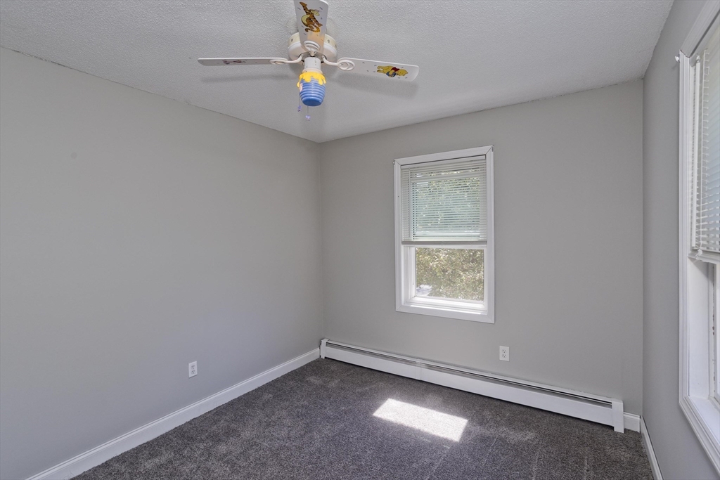 5 Michael Drive Enfield, CT 06082 - Photo 21 of 38 an empty room with a window and natural light