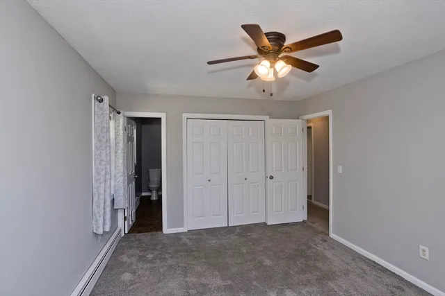 a view of room with window and ceiling fan