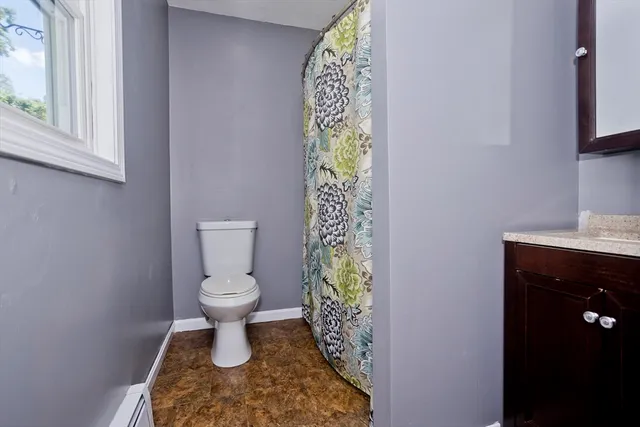 a bathroom with a toilet and a sink